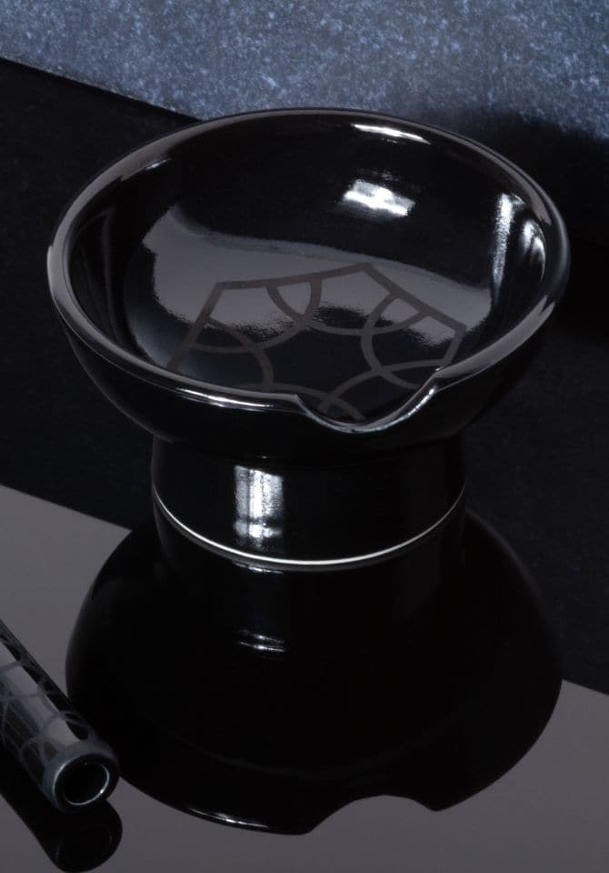 Our chicest black ashtray is etched with our logo pattern
