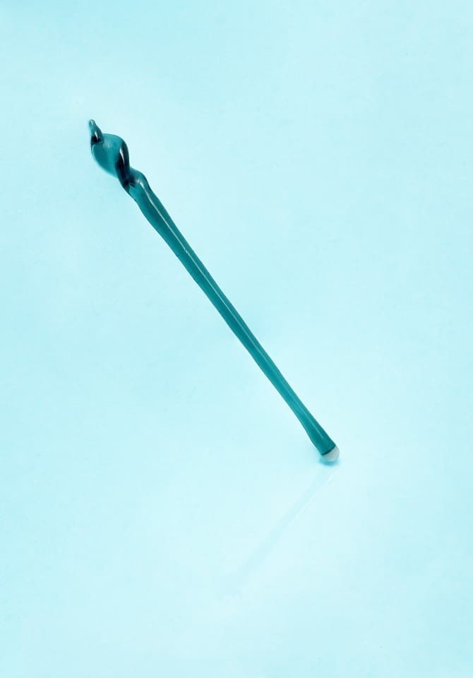 Stir your drink or tamp your mix with our teal tamping stick