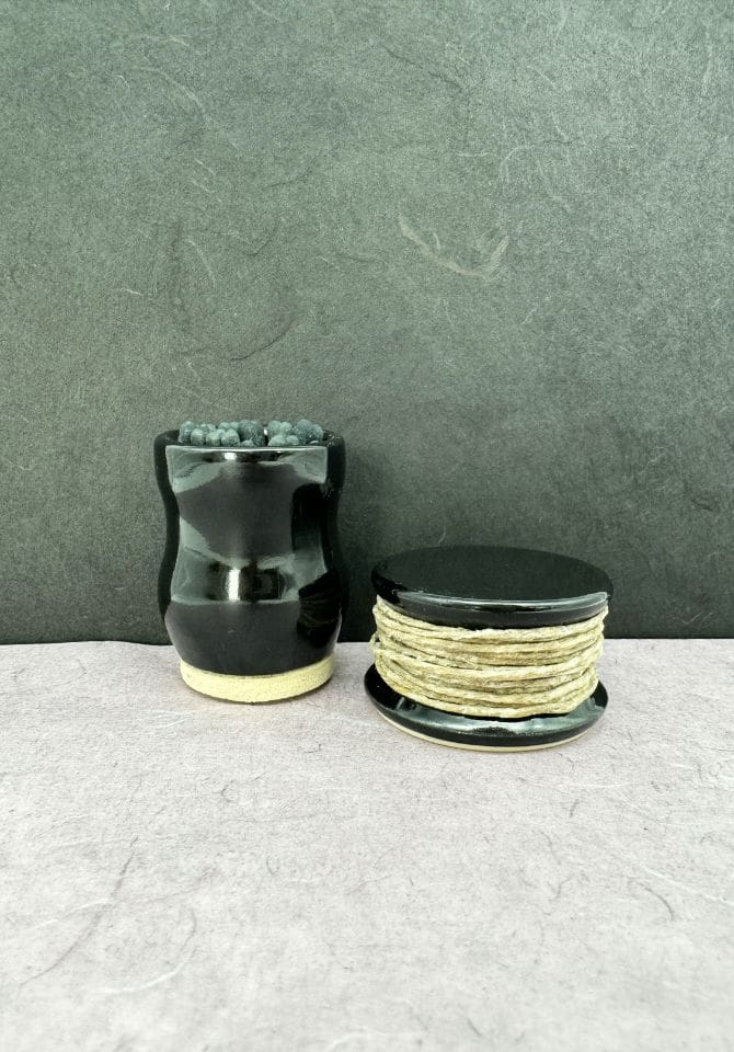 Uplift your light with our stunning black match striker and hemp wick holder