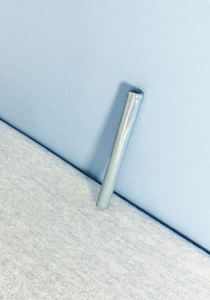 The length of our iridescent blue one hitter cools your smoke before it hits your throat