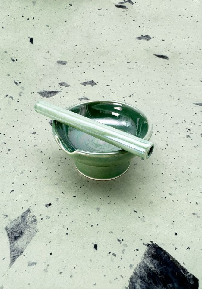 Our iridescent green ashtray sets include a matching one hitter