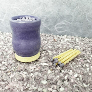 Our sculptural purple matchstick holder turns lighting up into an artful ritual