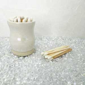Our sculptural iridescent white matchstick holder turns lighting up into an artful ritual