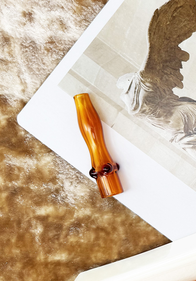 Our brown joint holder cools your smoke and makes every sesh feel fancy