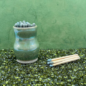 Our sculptural iridescent green matchstick holder turns lighting up into an artful ritual