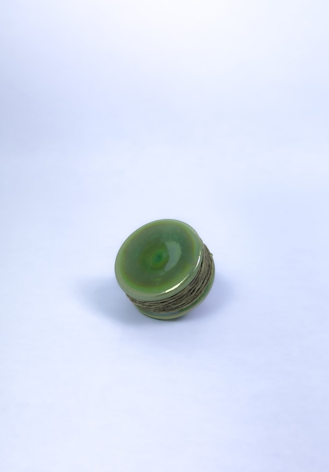 Keep your smoke clean and your hemp wick neat with our iridescent green holder
